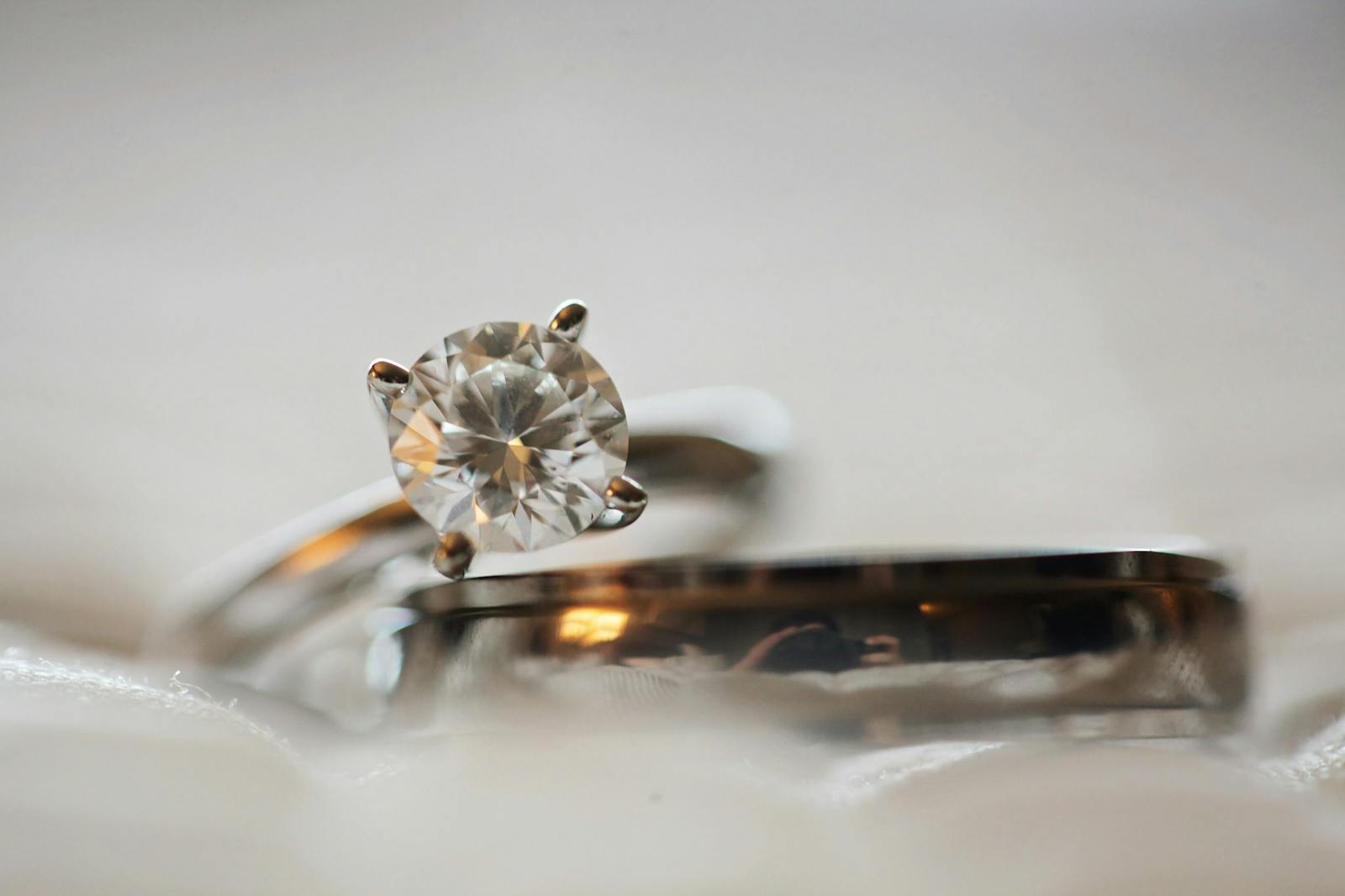 Elegant macro shot of a diamond engagement ring set with a blurred background.